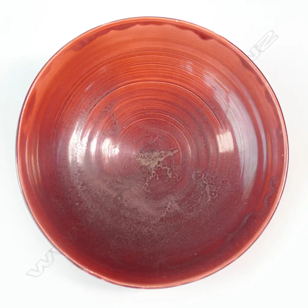 Doreen Blumhardt (1914-2009) red glazed flared bowl c.1960 - incised potter's mark within the foot. Dia.195mm. Tiny flake chip to foot. Provenance: Ex. The estate of Eleanor Blumhardt - the potter's sister. Image 1++
