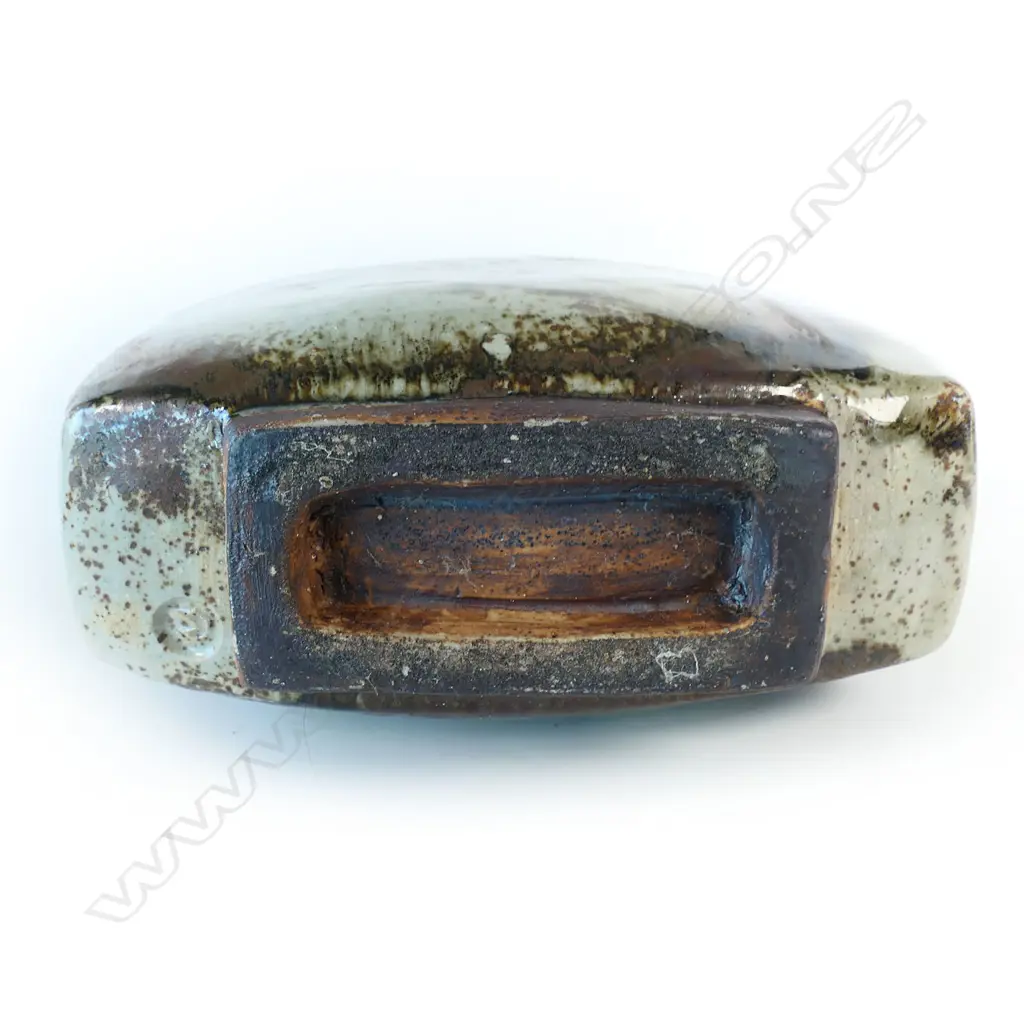 Doreen Blumhardt (1914-2009) stoneware slab vase with red and tenmoku poured glaze - tapered rectangular body with waisted circular rim and rectangular foot. Poured dark red/brown glaze with red highlights. Impressed potter's mark. c.1970. H.285mm. Image 1++