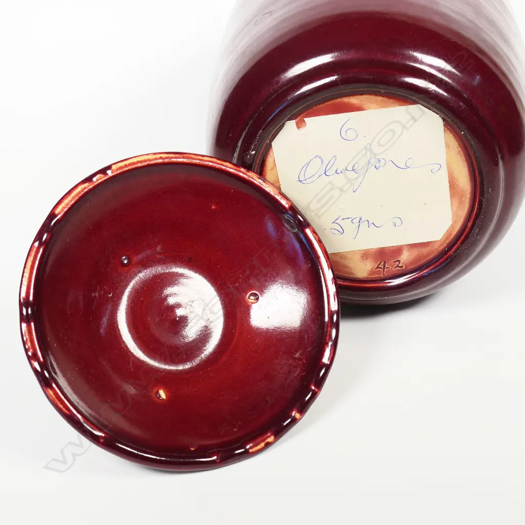 An Olive Jones (1893-1982) maroon glazed lidded pot. Signed and dated '42 to base. H.210mm. Image 1++