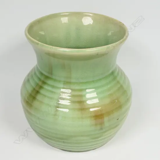 Crown Lynn Ambrico vase - green base glaze with brown highlights. Pre-1948 stamp to base and stamped numbers. H.150mm. Hairline and light crazing.