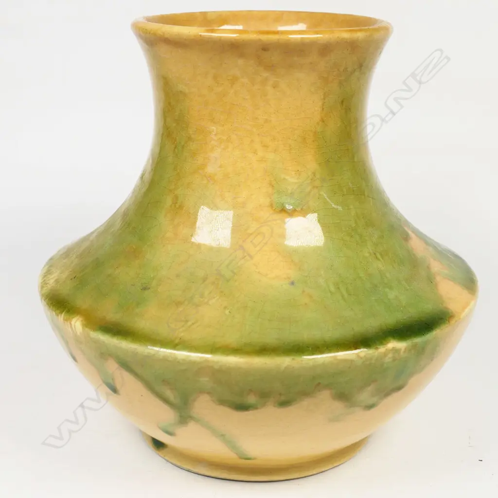 Crown Lynn Ambrico vase; mustard base with green overglaze. Pre-1948 stamp to base and stamped numbers. H.160mm. H Image 1++