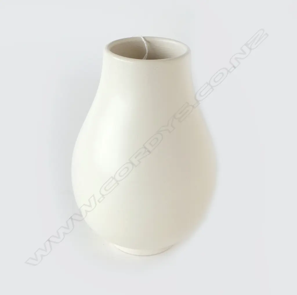 Crown Lynn uncommon shape Hand Potted vase -incised shape reference 'H6'. Of ovoid form with ring foot. Printed marks. H,230mm. Tiny chip to foot, faint crazing around rim & internally. Image 1++