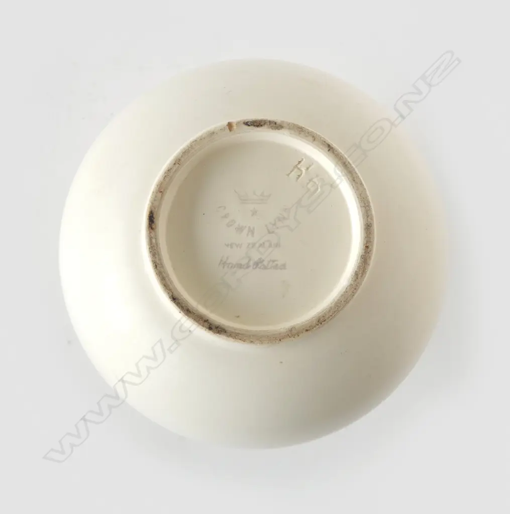 Crown Lynn uncommon shape Hand Potted vase -incised shape reference 'H6'. Of ovoid form with ring foot. Printed marks. H,230mm. Tiny chip to foot, faint crazing around rim & internally. Image 1++