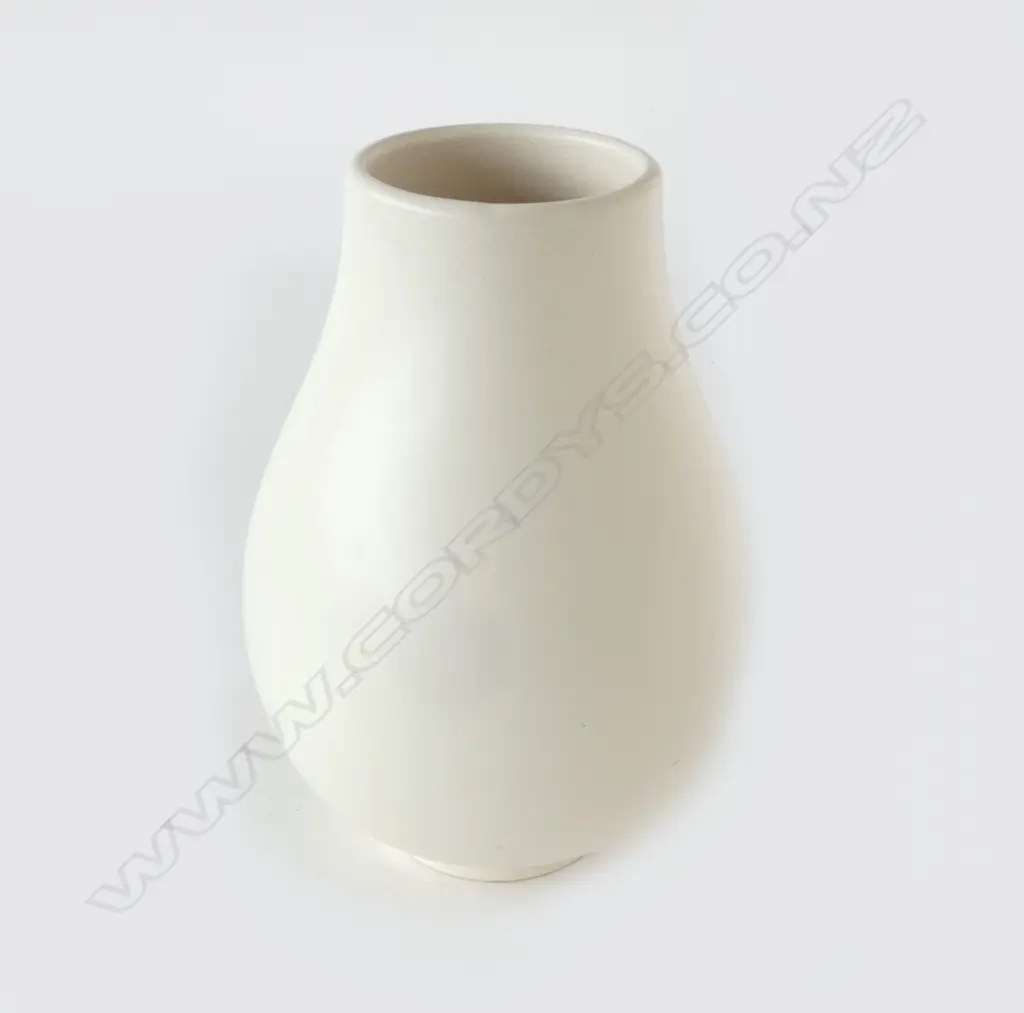 Crown Lynn uncommon shape Hand Potted vase -incised shape reference 'H6'. Of ovoid form with ring foot. Printed marks. H,230mm. Tiny chip to foot, faint crazing around rim & internally. Image 1++