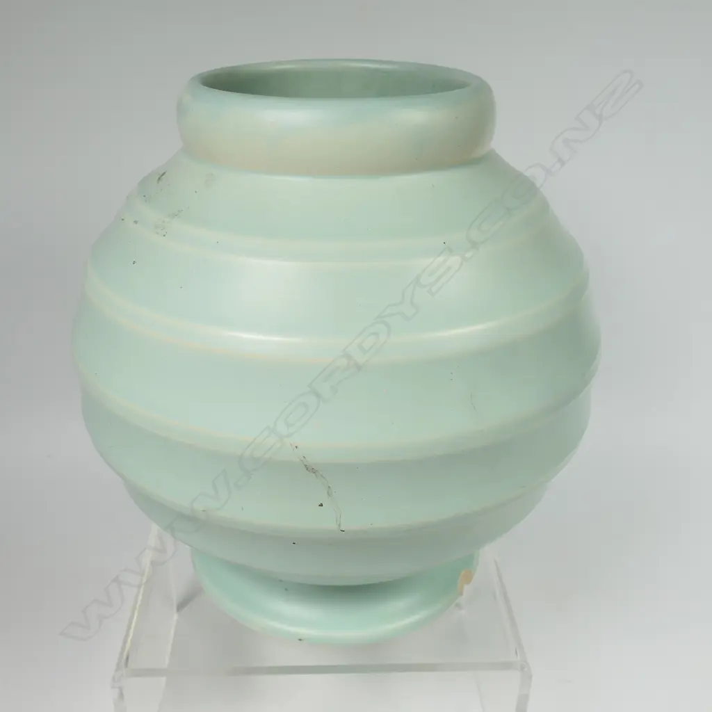 Crown Lynn Hand Potted pale teal green vase - medium size, shape 14 with six concave bands to the spherical body. Chip to foot. H.184mm. Image 1++
