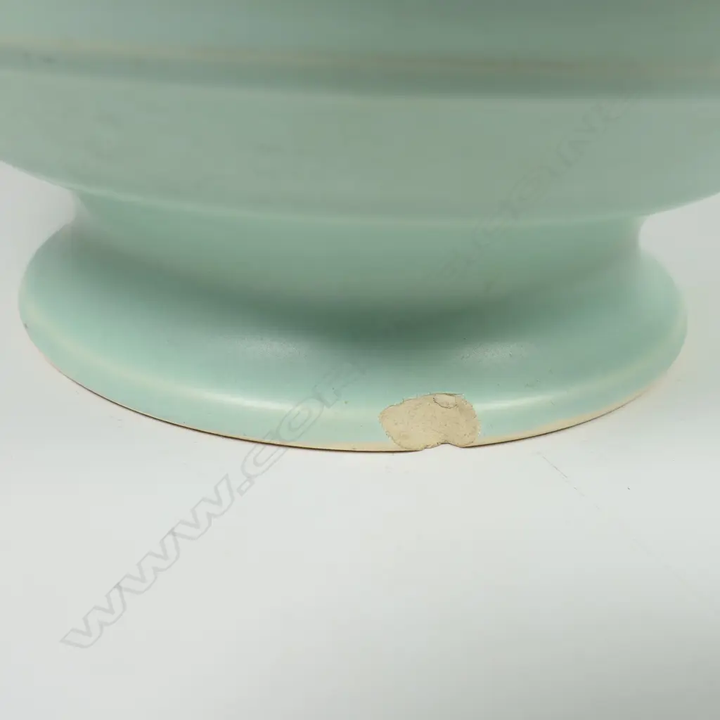 Crown Lynn Hand Potted pale teal green vase - medium size, shape 14 with six concave bands to the spherical body. Chip to foot. H.184mm. Image 1++