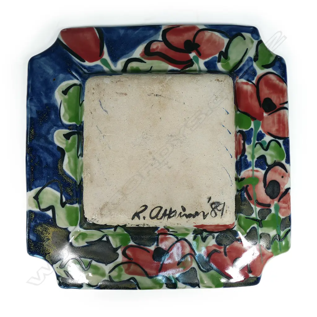 Raewyn Atkinson studio pottery squared dish - hand painted coloured glaze of red florals on blue, gold highlights. Signed and dated '89. W.330mm. Image 1++