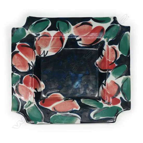 Raewyn Atkinson studio pottery squared dish; hand painted coloured glaze of red florals on blue. Signed and labelled. W.305mm.
