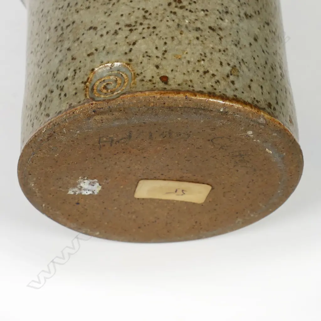 Adrian Cotter tall cylindrical vase with swollen mid-section decorated with large spiral motif. Impressed monogram near base. H.260mm. Provenance: purchased from an exhibition Alicat Gallery Ponsonby 1970s. Image 1++