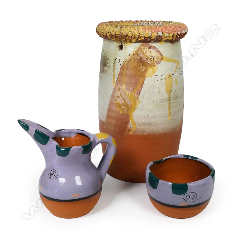 Steve Fullmer (Nelson) wine cooler, small jug and matching bowl - jug and bowl in vivid mauve glaze. Incised and glazed decoration, the jug with tall spout. Cooler H.235mm. Jug H.130mm. Vendor's note: Bought directly from the potter. Image 1++