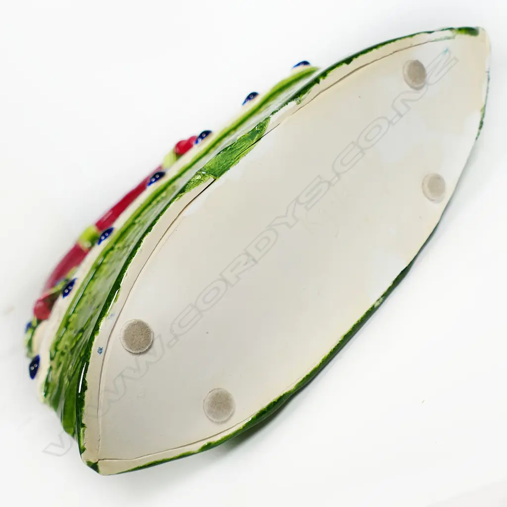 Katie Gold 'Handbag' finely decorated with plants 'Celandine' and green glazed impressed florals. Red handle. H.380mm. Vendor's note: Bought directly from the potter. Image 1++