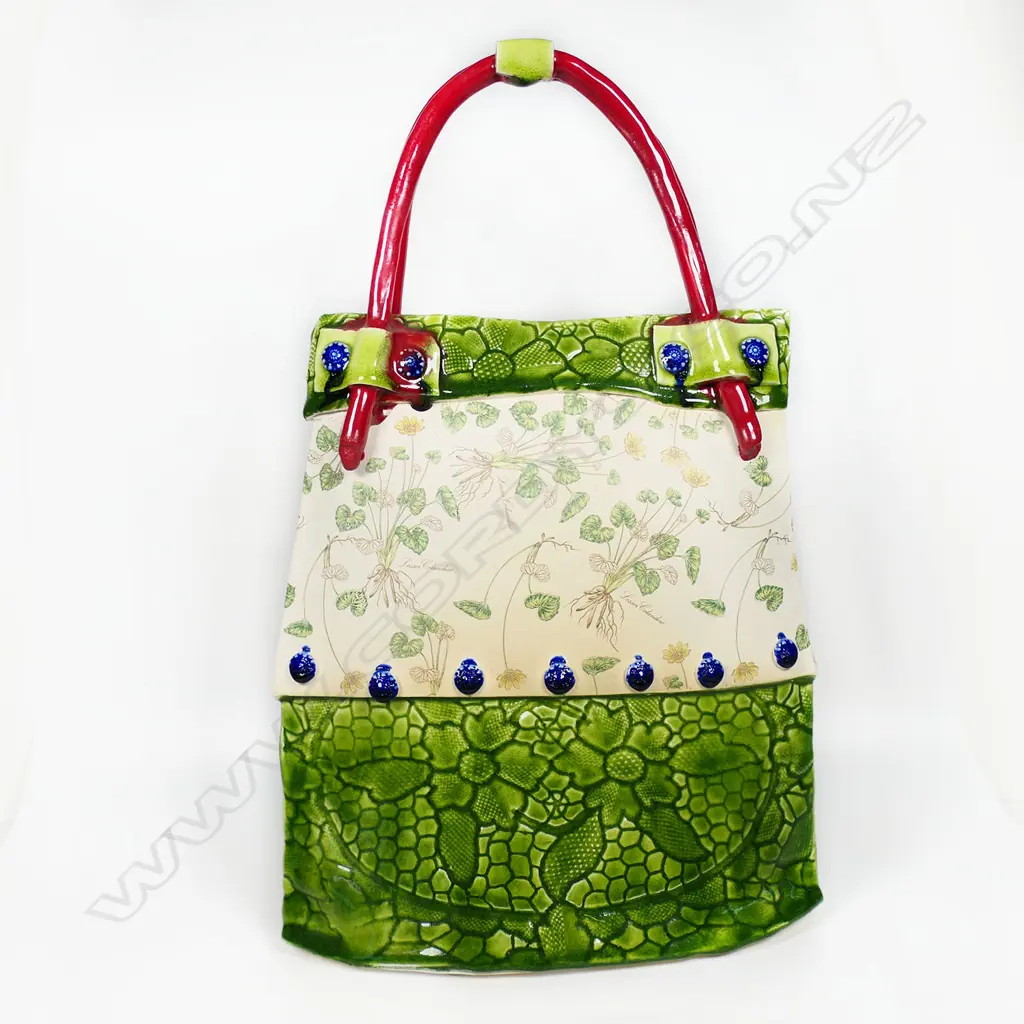 Katie Gold 'Handbag' finely decorated with plants 'Celandine' and green glazed impressed florals. Red handle. H.380mm. Vendor's note: Bought directly from the potter. Image 1++