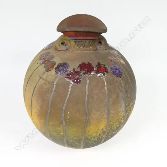 Mark James spherical vase; raku fired with altered mouth and lug handles. Decorated with overglazed flowers. Earth tones with copper glaze highlights. Potter's stamp to base. H.165mm