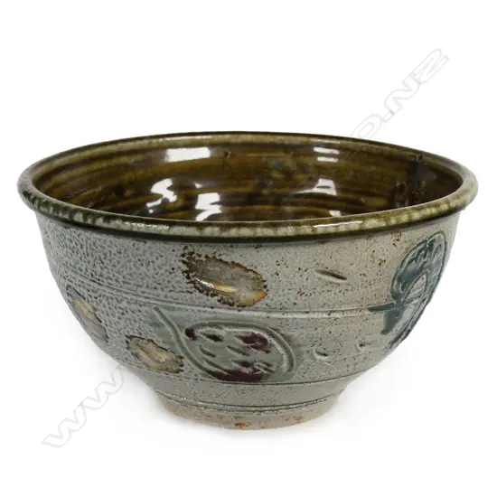 Peter Lange salt glazed footed bowl; olive brown glazed interior, exterior decorated with incised creatures and patterns. Potter's name stamped to side. Dia.204mm. H.110mm. Small chip underneath foot.