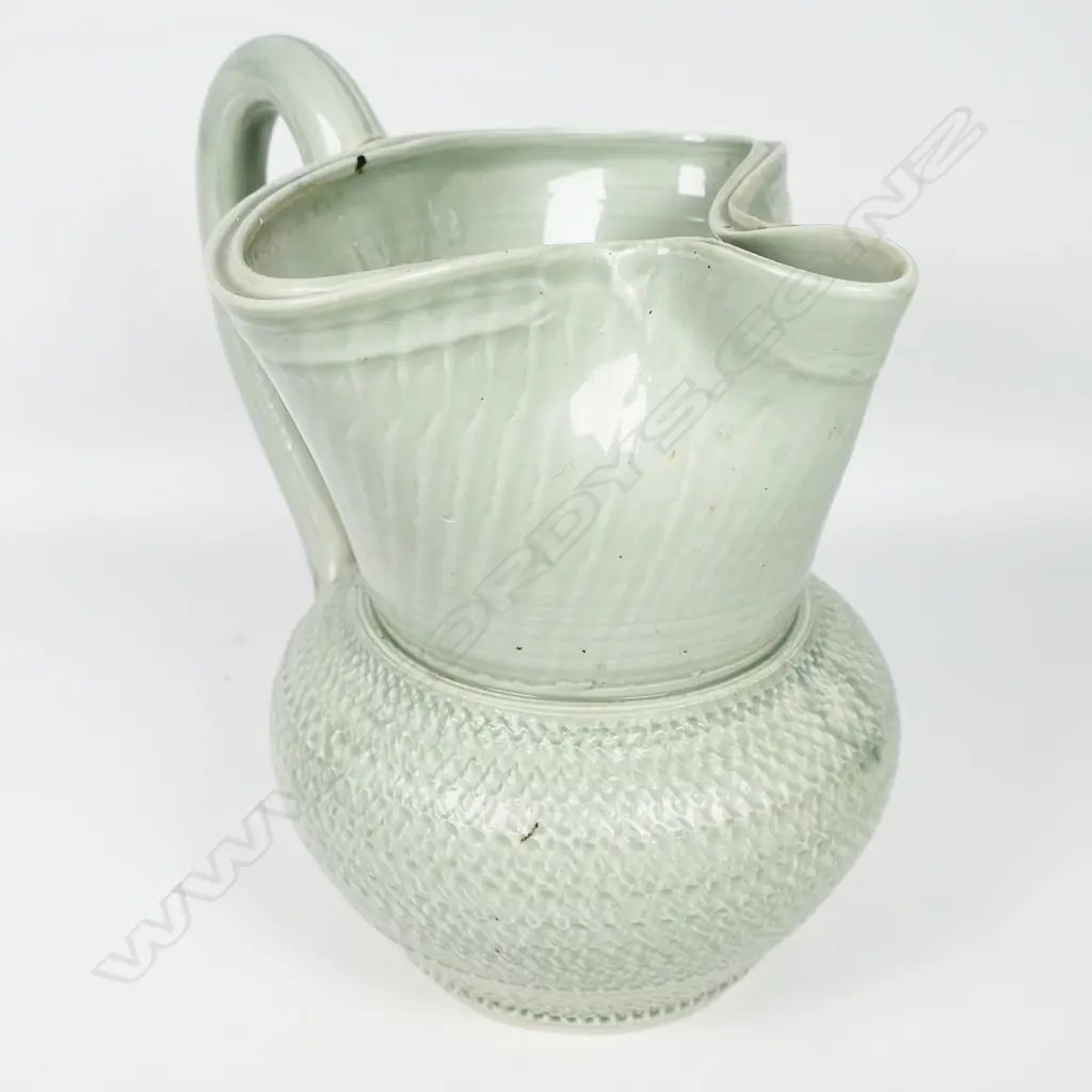 Ross Mitchell-Anyon (1954-2022) celadon glazed porcelain jug with textured body. Potter's mark at handle base. H.165mm. Image 1++
