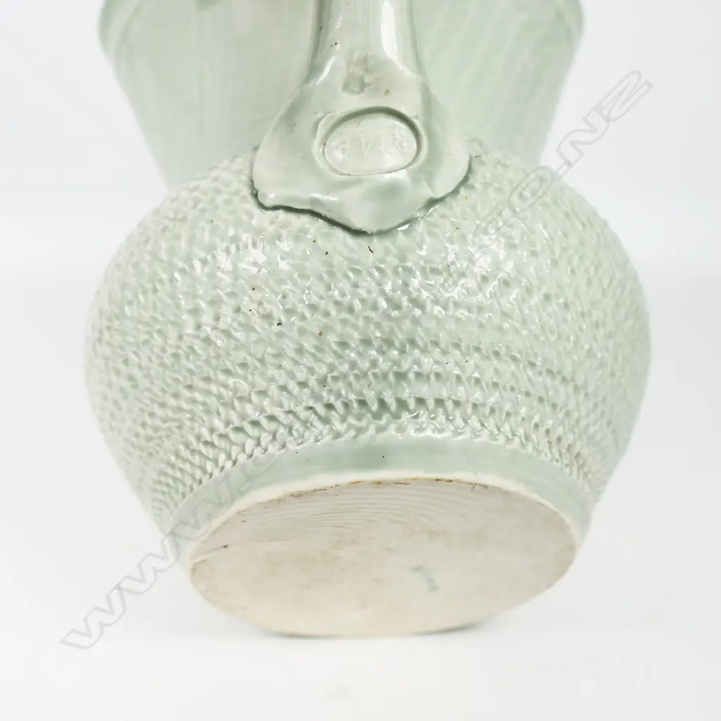 Ross Mitchell-Anyon (1954-2022) celadon glazed porcelain jug with textured body. Potter's mark at handle base. H.165mm. Image 1++