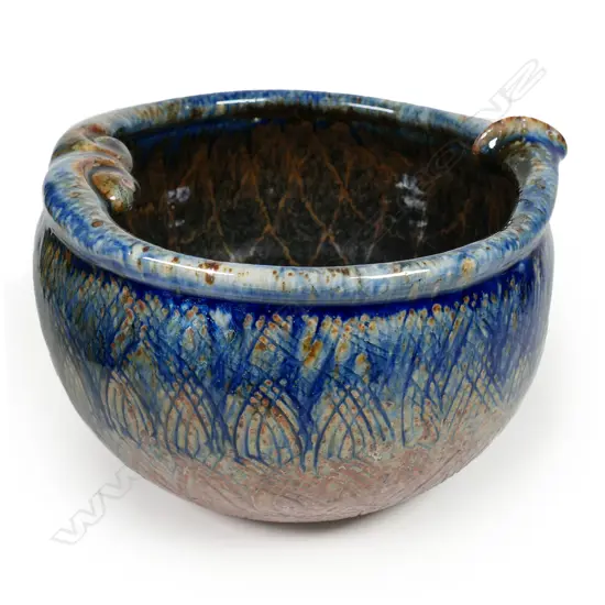 Mike O'Donnell bowl with a lustrous blue tan dark glazed body and a sculpted rim with combed decoration, H.155 Dia.210mm