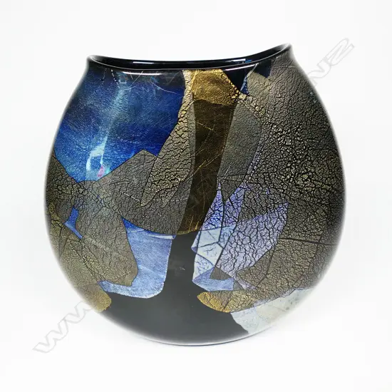 Garry Nash (ONZM) gold and silver leaf glass vase, of flattened ovoid form decorated with overlapping leaf patterns on a black ground. Signed and dated '03 to lower side. H.230mm