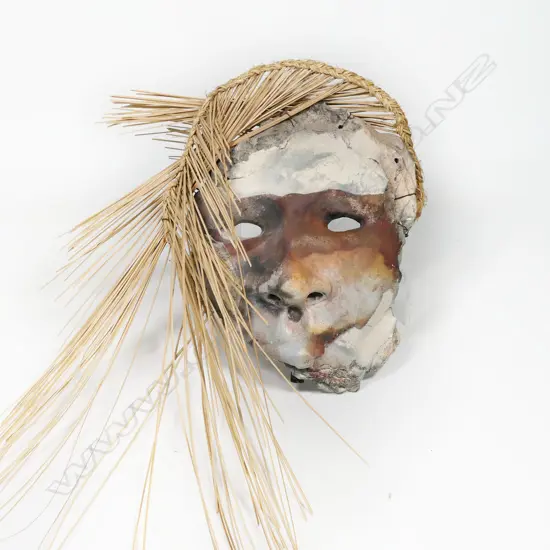 Helen Pollock raku fired mask with rope and reed adornment. Sturdy wall hanging assemblage to rear. Mask H.280 x 230mm, H.800mm total with reeds