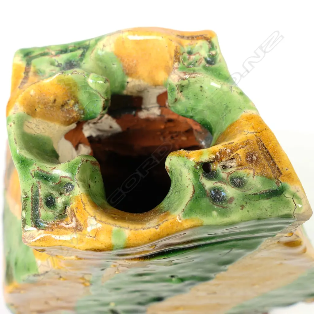 A large Richard Parker pottery vase; square baluster angular shape with quatrefoil mouth; with bands of caramel, green and pale glaze. Minor glaze frits. Artist's label to base. H.160mm. Image 1++