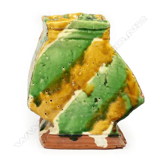 A large Richard Parker pottery vase; square baluster angular shape with quatrefoil mouth; with bands of caramel, green and pale glaze. Minor glaze frits. Artist's label to base. H.160mm.