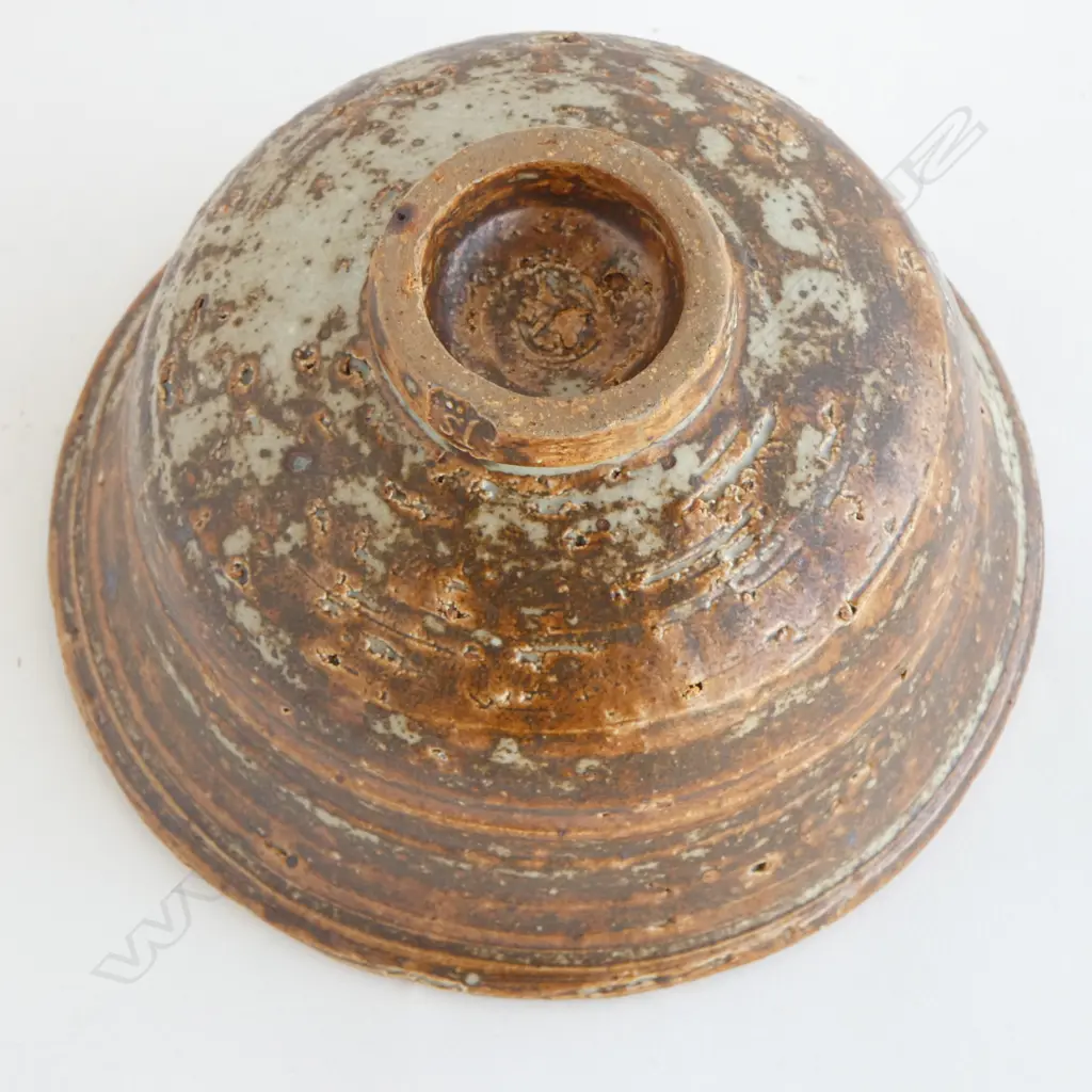 Jeff Scholes bowl with defined throwing marks and variable glaze of grey over rust brown. Stamped mark. Dia.175mm. Vendor's note: Bought directly from the potter. Image 1++