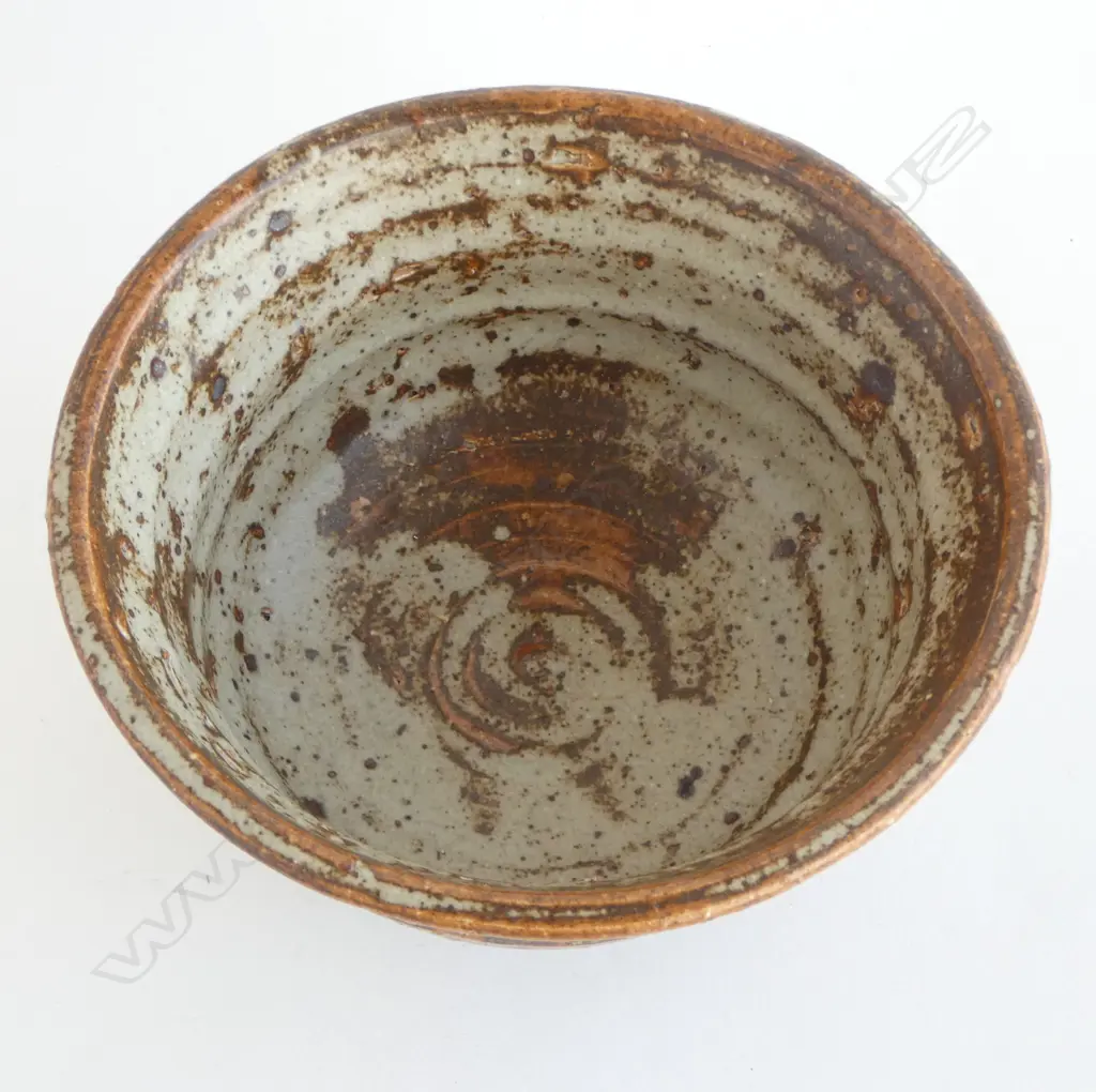 Jeff Scholes bowl with defined throwing marks and variable glaze of grey over rust brown. Stamped mark. Dia.175mm. Vendor's note: Bought directly from the potter. Image 1++