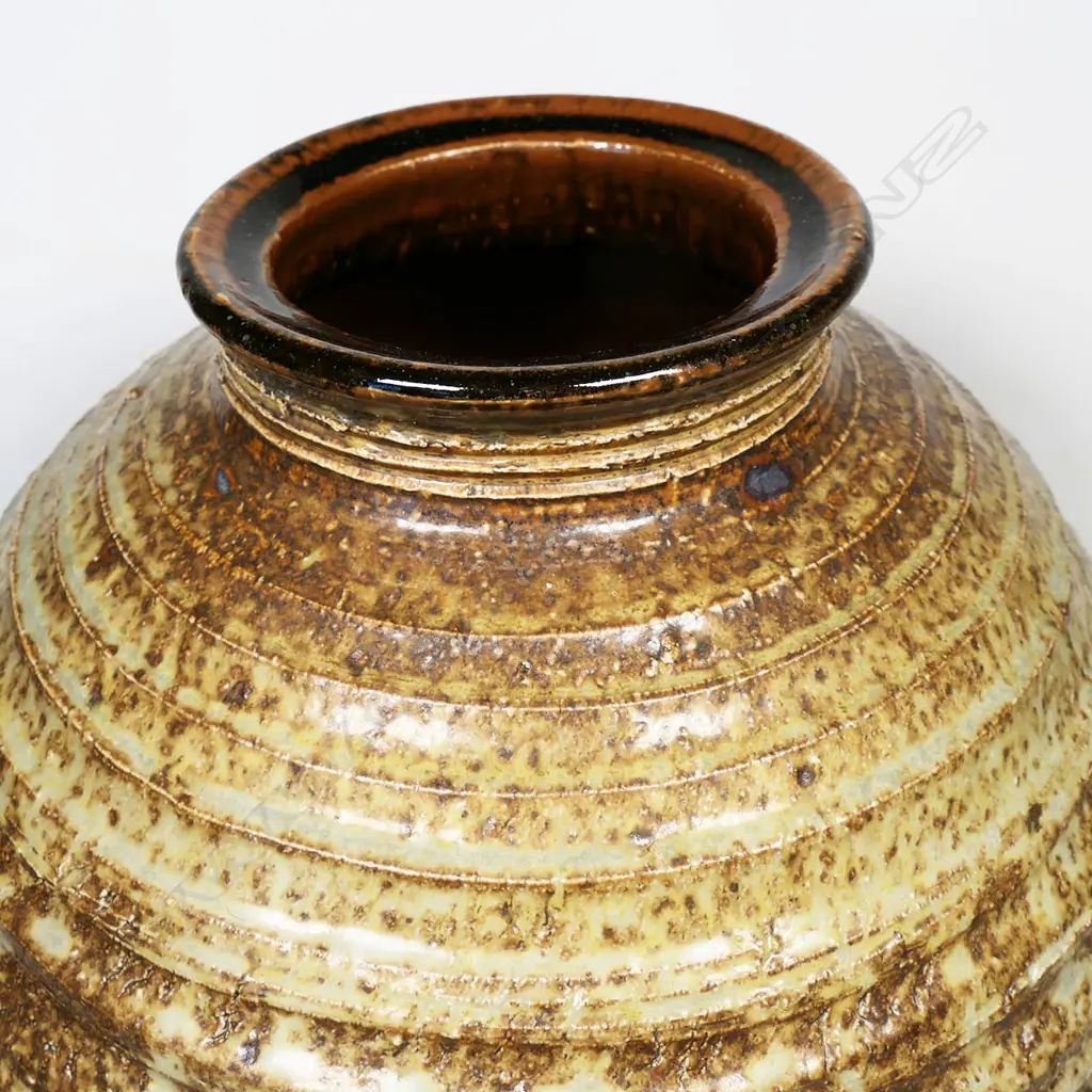 Warren Tippett vase with lathe turned linear circular design to body with soft celadon glaze highlights. H.260mm Image 1++