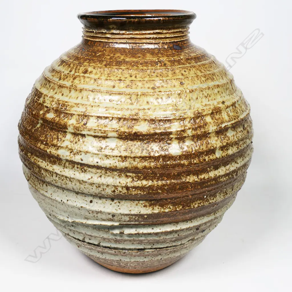 Warren Tippett vase with lathe turned linear circular design to body with soft celadon glaze highlights. H.260mm Image 1++