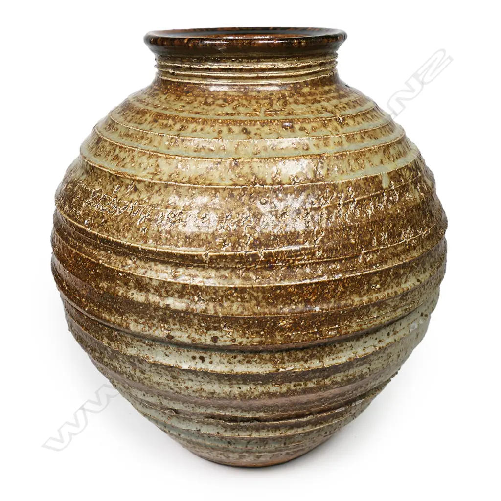 Warren Tippett vase with lathe turned linear circular design to body with soft celadon glaze highlights. H.260mm Image 1++