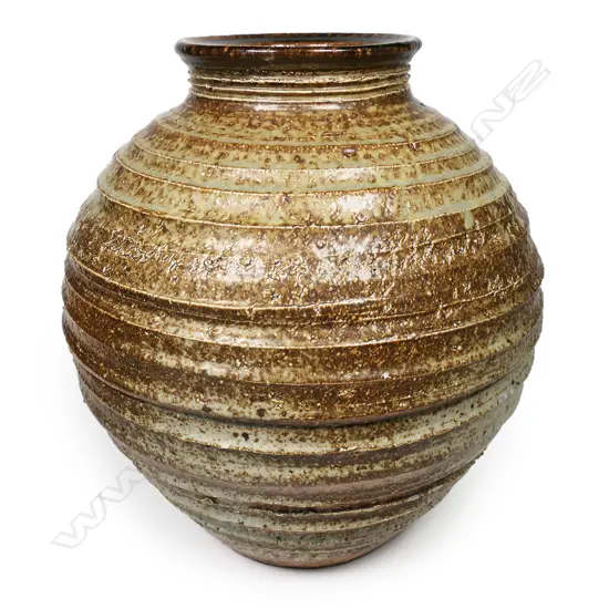 Warren Tippett vase with lathe turned linear circular design to body with soft celadon glaze highlights. H.260mm