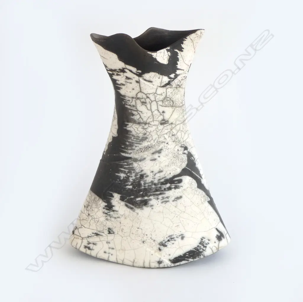 Rick Urban flared vase; flattened waisted form with curved base. Matte black and glossy white glaze effects. Impressed monogram to base. H.300mm Image 1++
