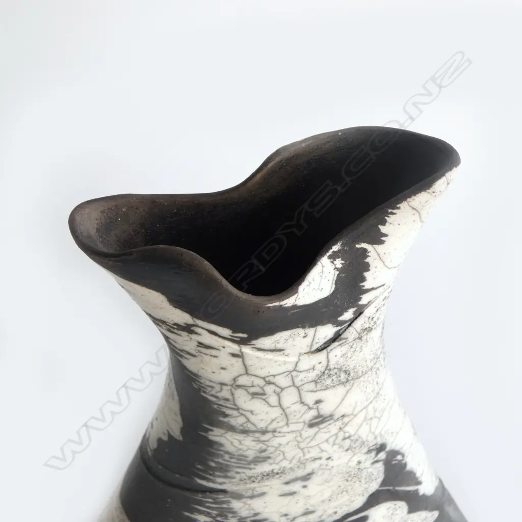 Rick Urban flared vase; flattened waisted form with curved base. Matte black and glossy white glaze effects. Impressed monogram to base. H.300mm Image 1++