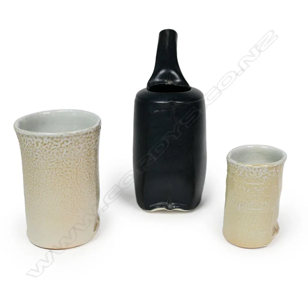 Chris Weaver three porcelain pieces; a black small pouring vessel and two small salt glazed vessels. Tallest H.135mm. Image 1++