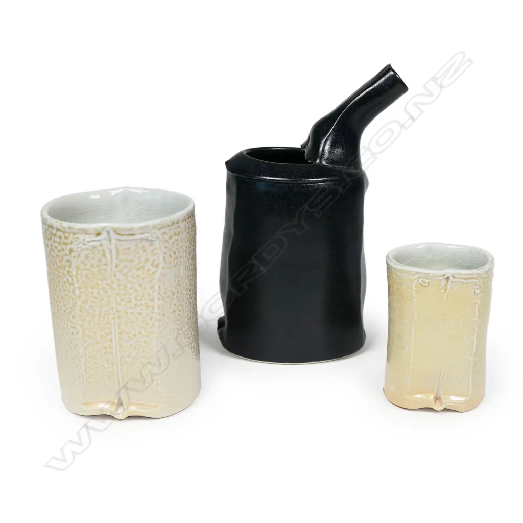 Chris Weaver three porcelain pieces; a black small pouring vessel and two small salt glazed vessels. Tallest H.135mm. Image 1++