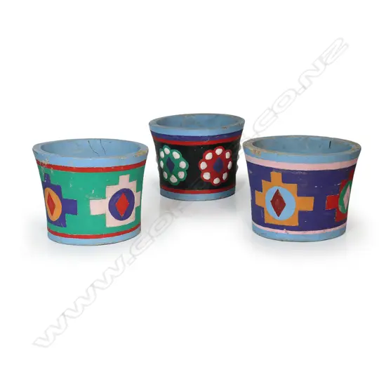 Three Ross Michie (Kaitaia Northland) colourful folk art decorated concrete planters. H.200mm. Dia.265mm. Some faults.