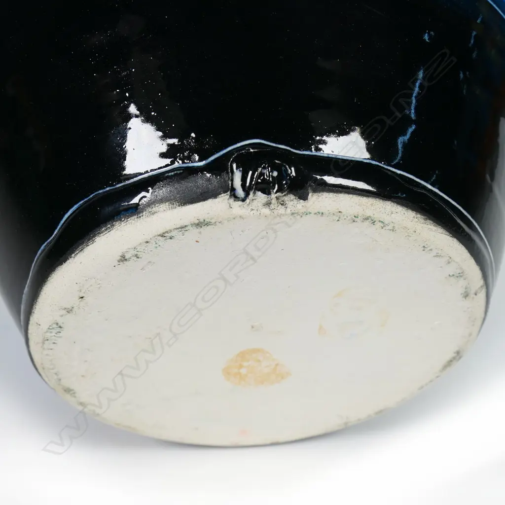 Andrew van der Putten flagon - aqua green and blue glazes with fish motif. Impressed potters mark. H.250mm. Frit to rim and small glaze losses. Image 1++