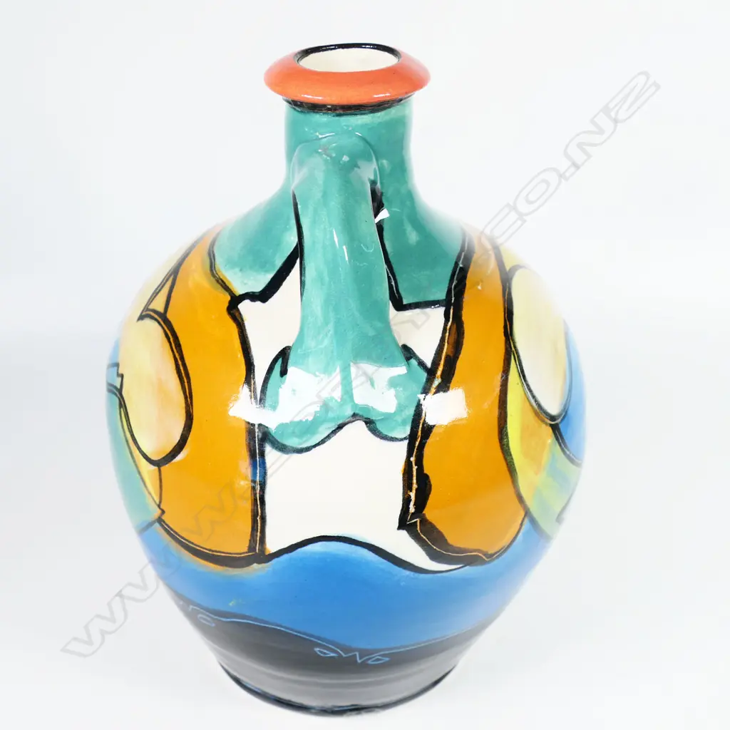 Andrew van der Putten flagon - aqua green and blue glazes with fish motif. Impressed potters mark. H.250mm. Frit to rim and small glaze losses. Image 1++