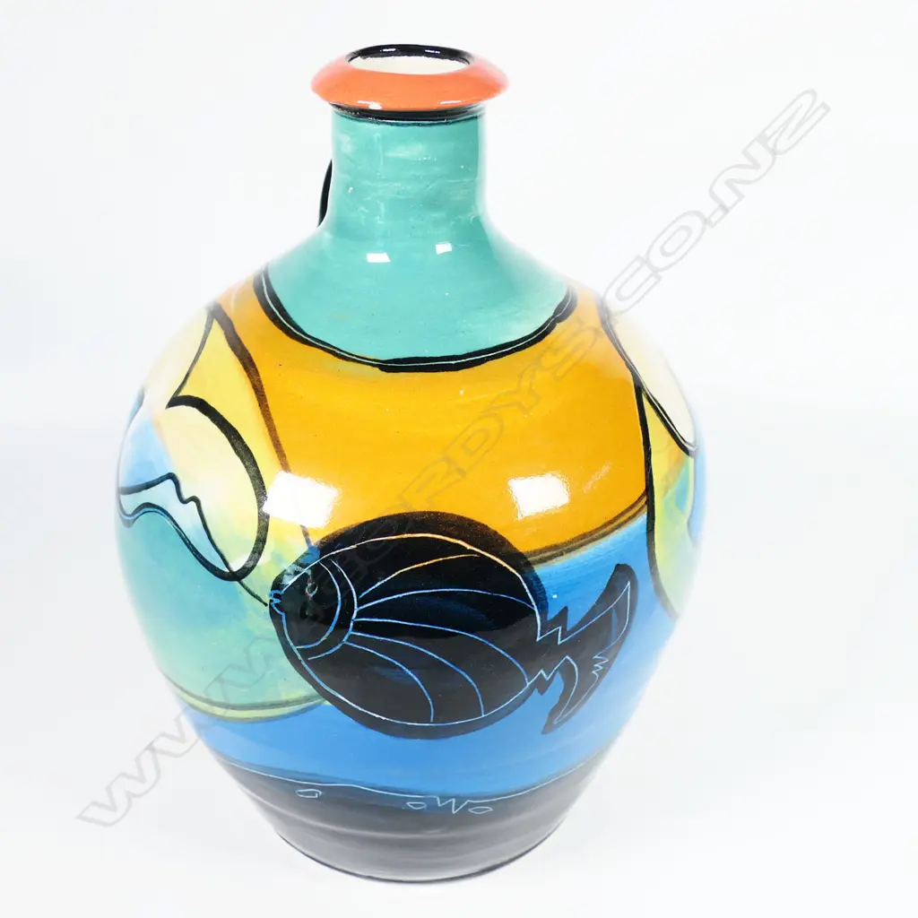 Andrew van der Putten flagon - aqua green and blue glazes with fish motif. Impressed potters mark. H.250mm. Frit to rim and small glaze losses. Image 1++