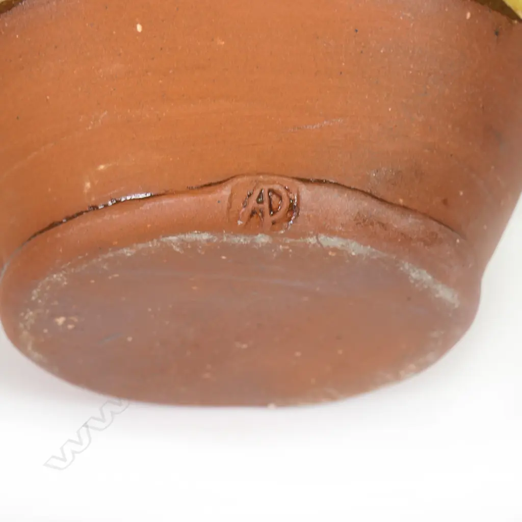 Andrew van der Putten large pitcher - with strap handle and a thick green glaze transitioning to yellow, potter's mark to base. H.200mm Image 1++