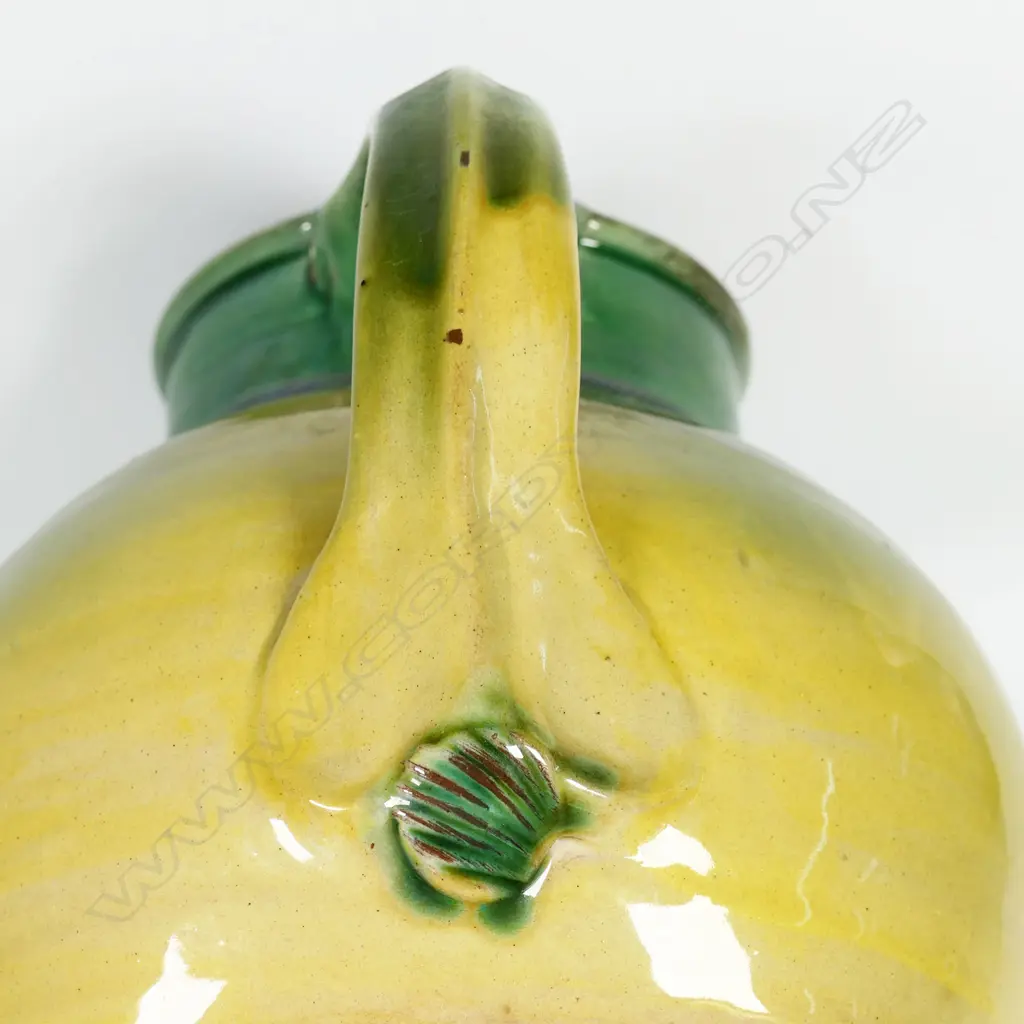 Andrew van der Putten large pitcher - with strap handle and a thick green glaze transitioning to yellow, potter's mark to base. H.200mm Image 1++