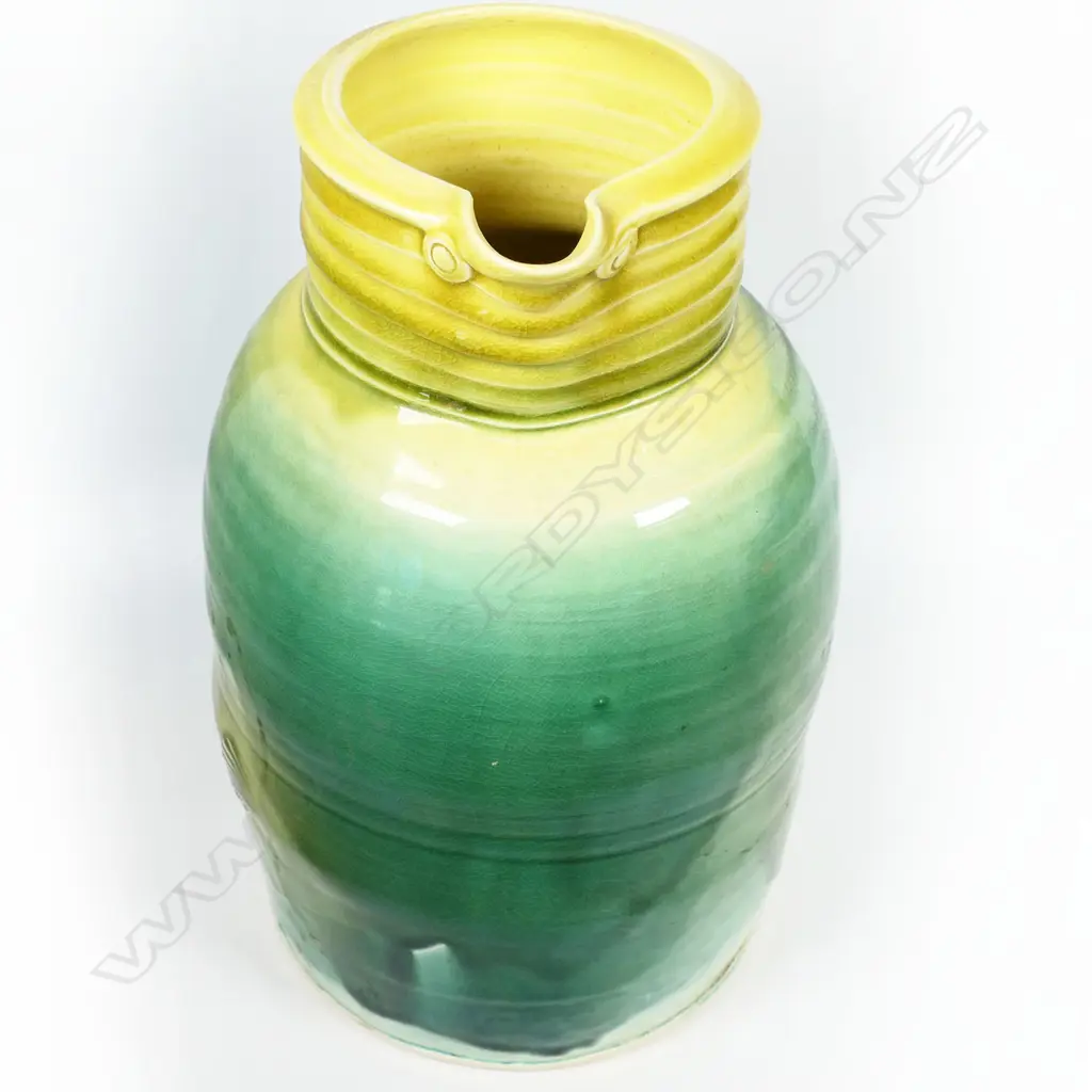 Andrew van der Putten large pitcher - milk can shape with coiled band around neck, bird eye detail and thick yellow and green glaze. Potter's mark to base. H.300mm Image 1++