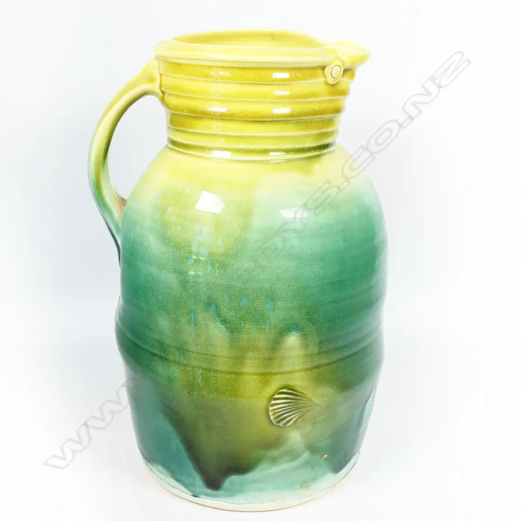 Andrew van der Putten large pitcher - milk can shape with coiled band around neck, bird eye detail and thick yellow and green glaze. Potter's mark to base. H.300mm Image 1++