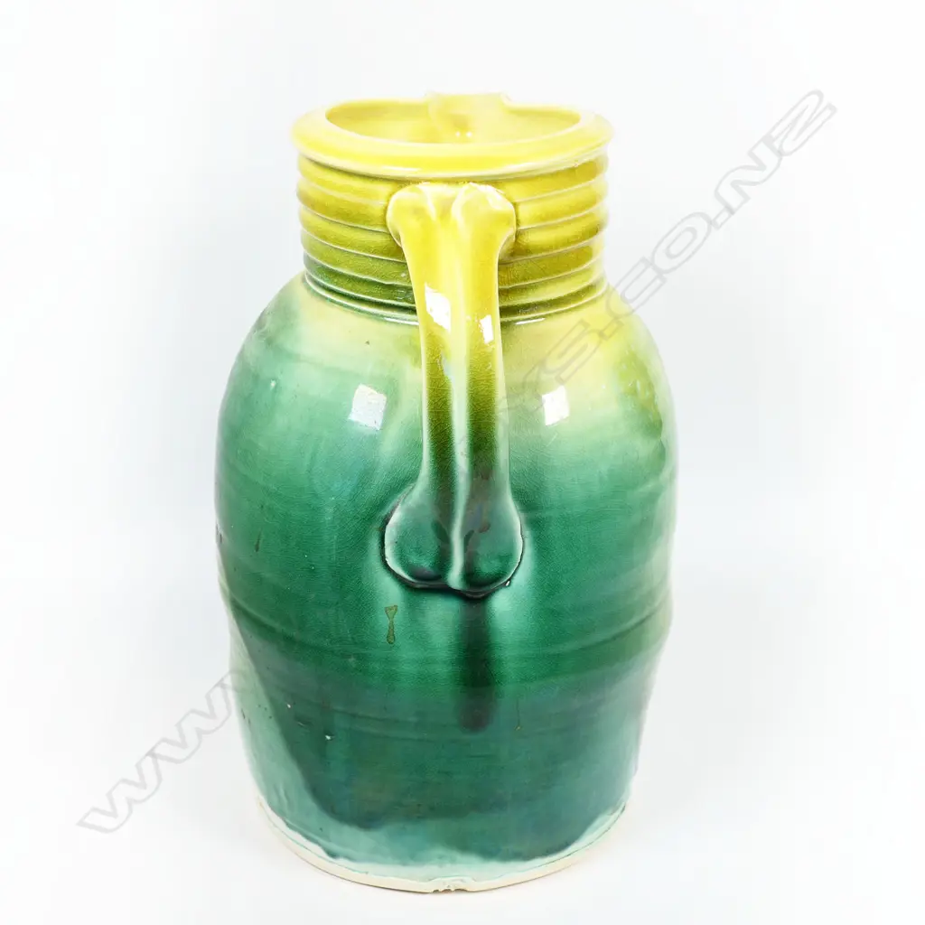 Andrew van der Putten large pitcher - milk can shape with coiled band around neck, bird eye detail and thick yellow and green glaze. Potter's mark to base. H.300mm Image 1++