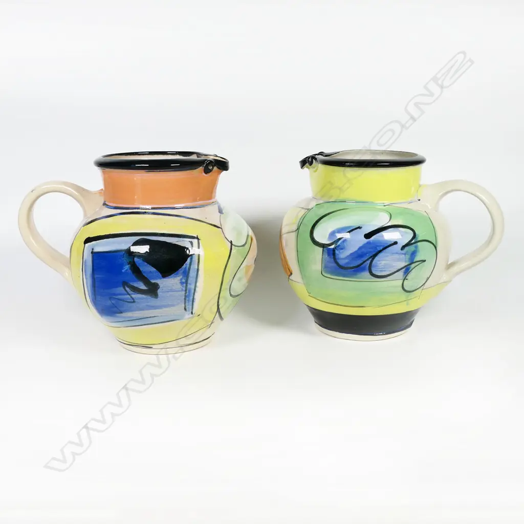 Two Andrew van der Putten jugs - bright modern designs with bird eye spout detail. Both with potter's mark to base. H.140/150mm Image 1++