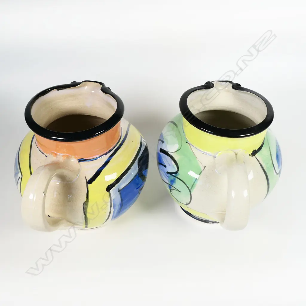 Two Andrew van der Putten jugs - bright modern designs with bird eye spout detail. Both with potter's mark to base. H.140/150mm Image 1++