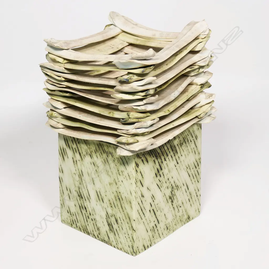 Square vase with lattice top on a cedarwood stand. Matte finish with incised rain-like design to sides. Potter unknown, triangle mark to base. H.260mm x 140sq Image 1++