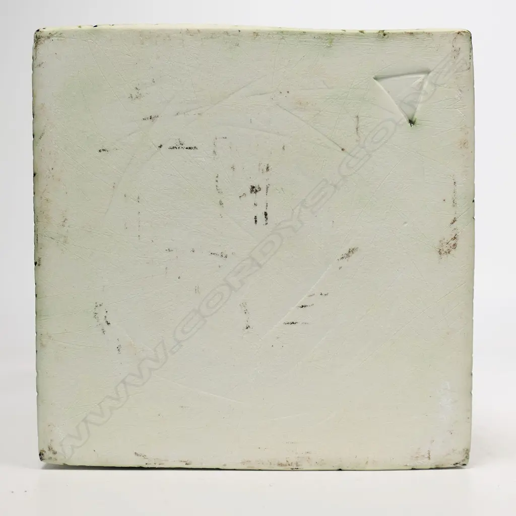 Square vase with lattice top on a cedarwood stand. Matte finish with incised rain-like design to sides. Potter unknown, triangle mark to base. H.260mm x 140sq Image 1++