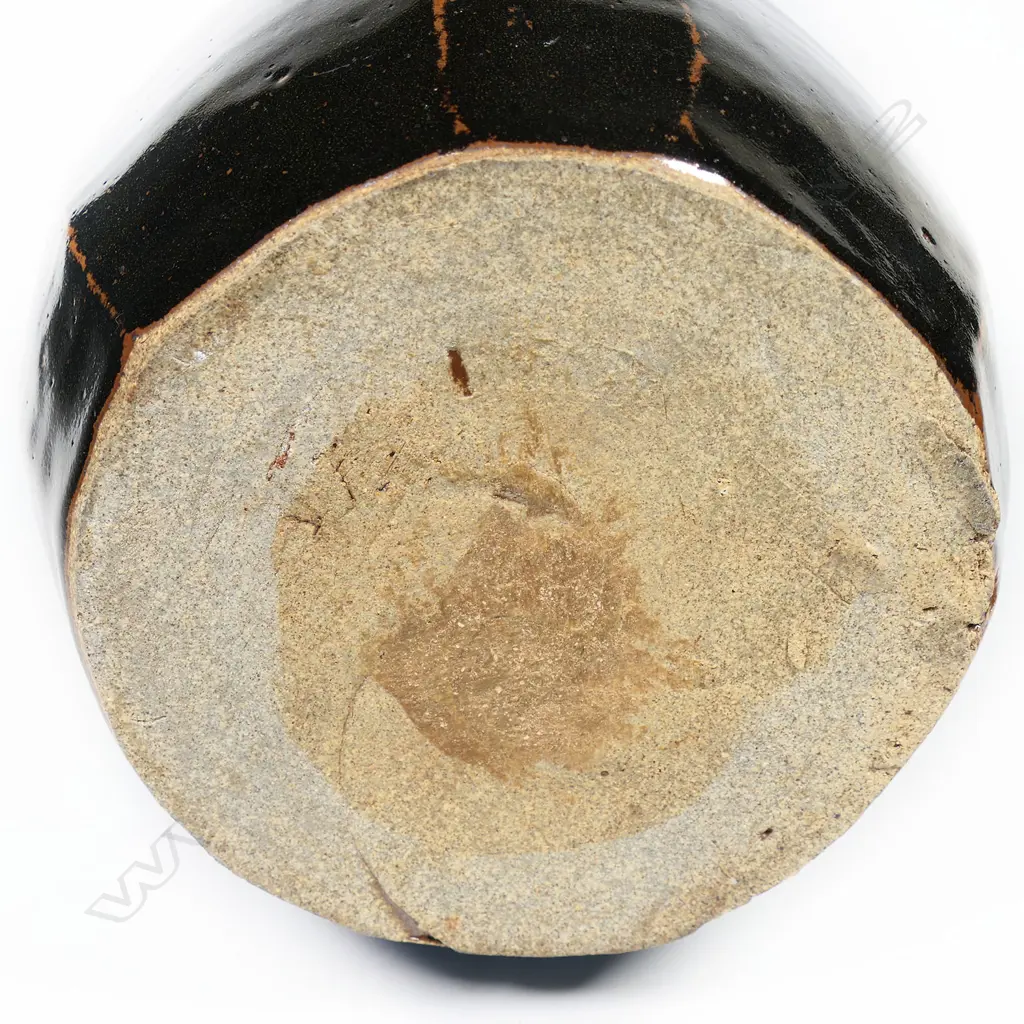 Potter unknown Anglo-Oriental mallet form stoneware vase. The facetted body with tenmoku glaze. Blue glaze to the neck. Apparently unmarked. H.350mm. Image 1++