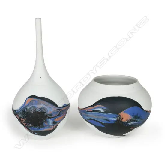 Potter unknown twosmall porcelain vases; grey/white matte finish with thick blue/black glaze dripped across the body. H.70/140mm